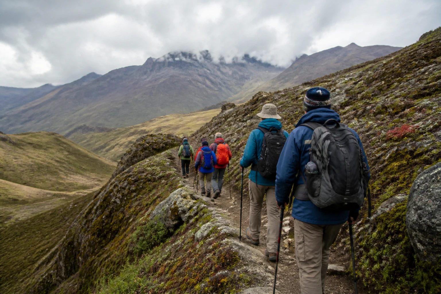 Guided hikers on a highland path in the Cusco region