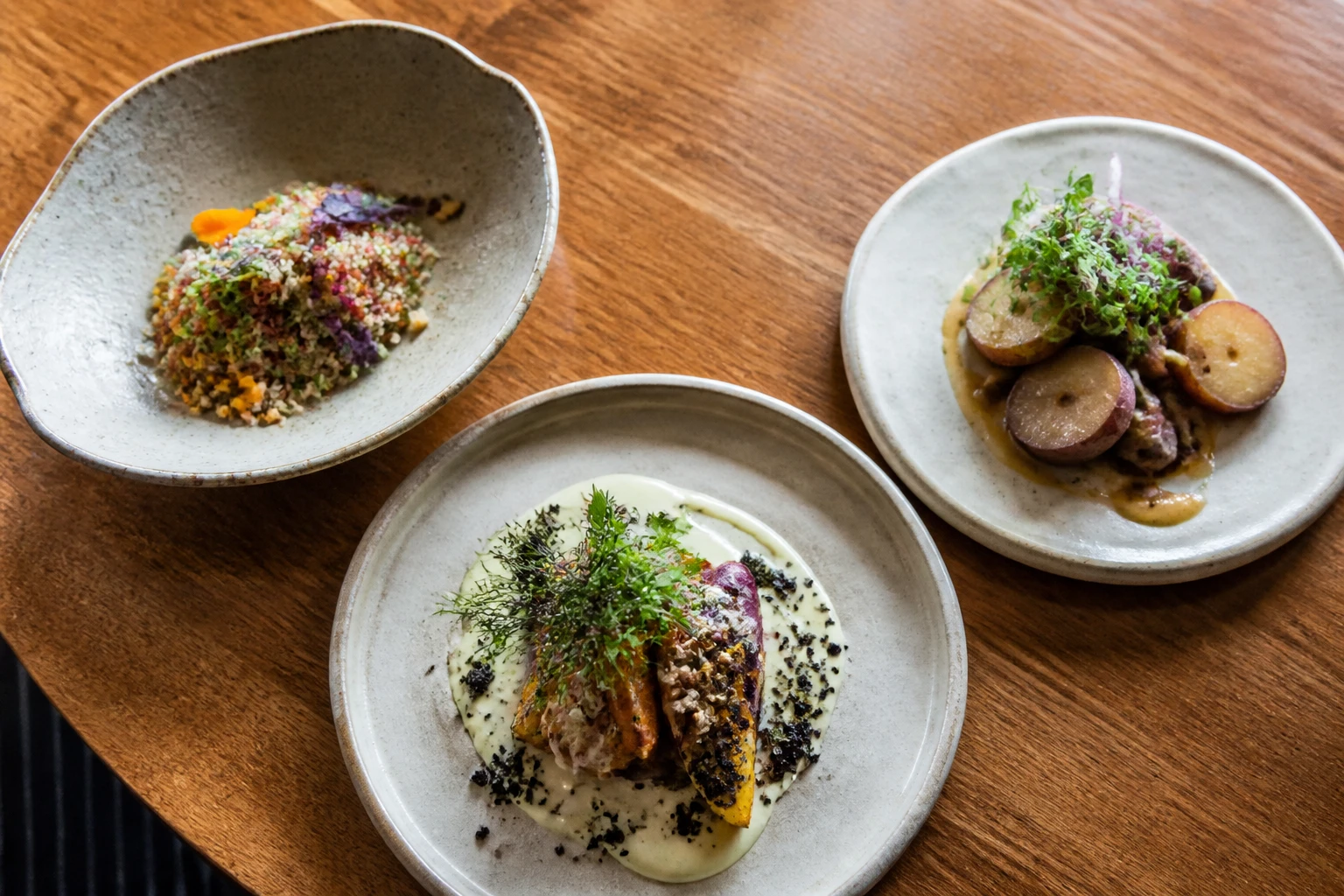 Contemporary Peruvian dishes served on ceramic plates