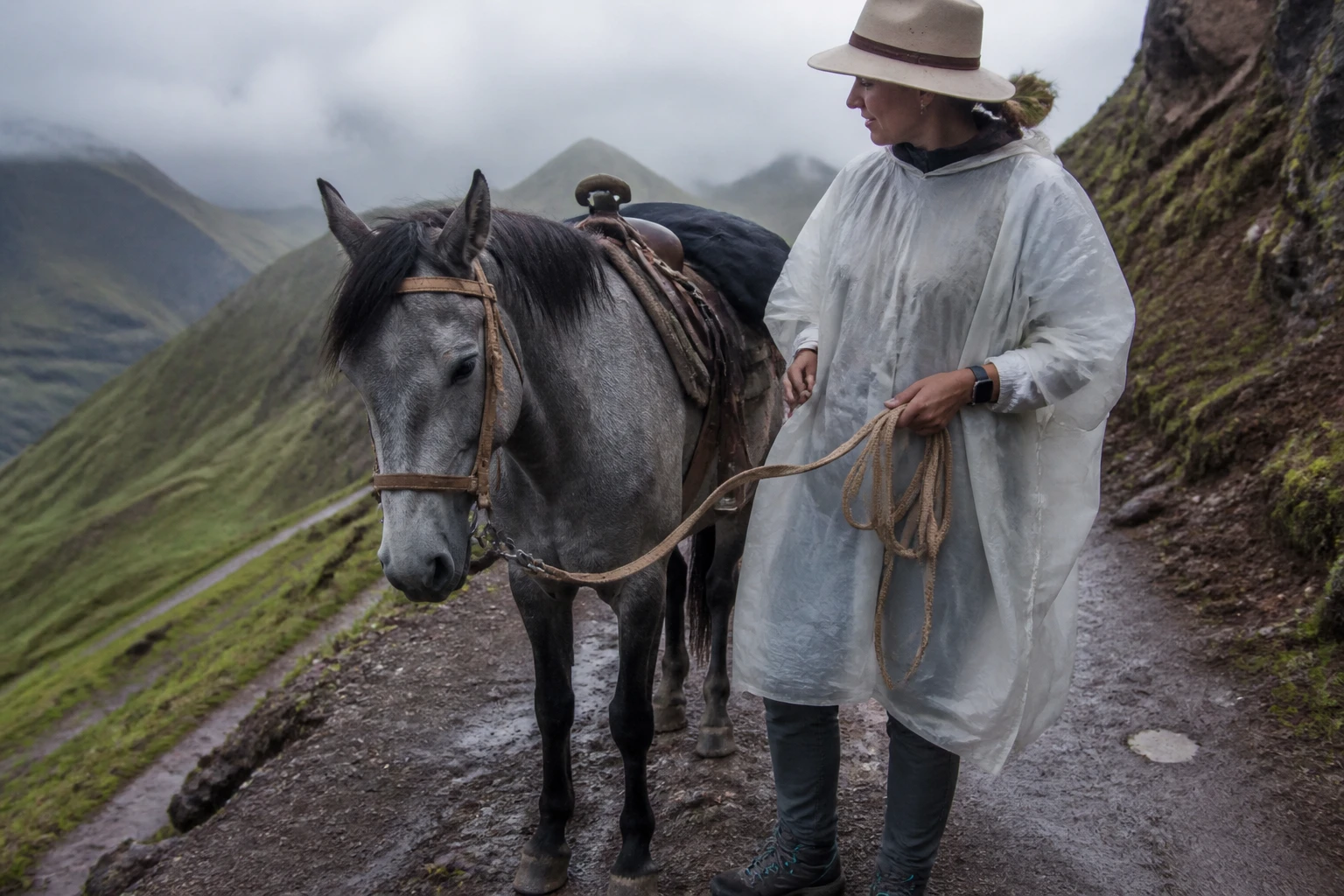 Traveler prepared for changing weather on a Cusco horseback ride
