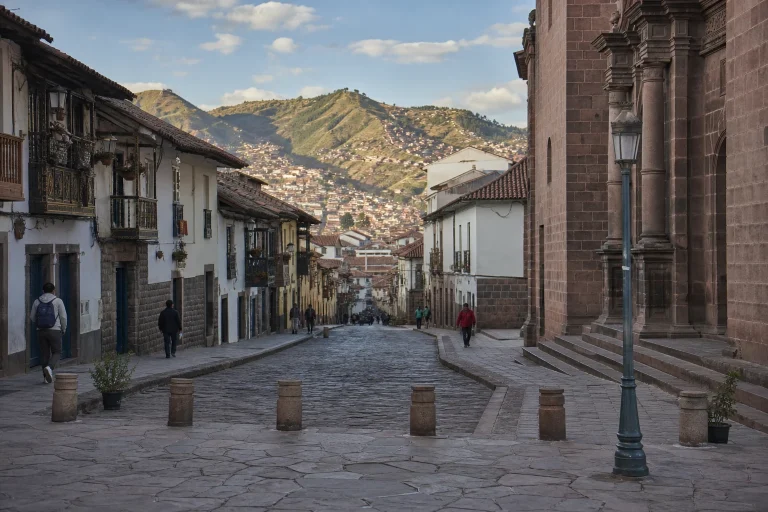 Morning view of a stone-paved street in Cusco's historic center.
