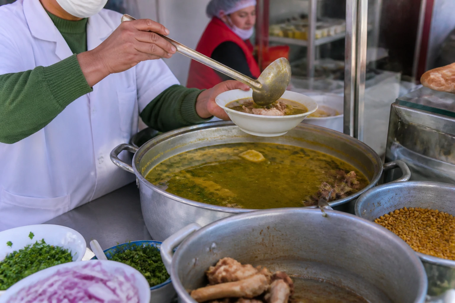 A freshly prepared meal at a Cusco market counter